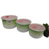 Three ceramic bowls with plastic lids