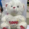 White Teddy Bear holding a heart