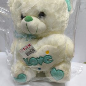 The heart pillow says "Love".